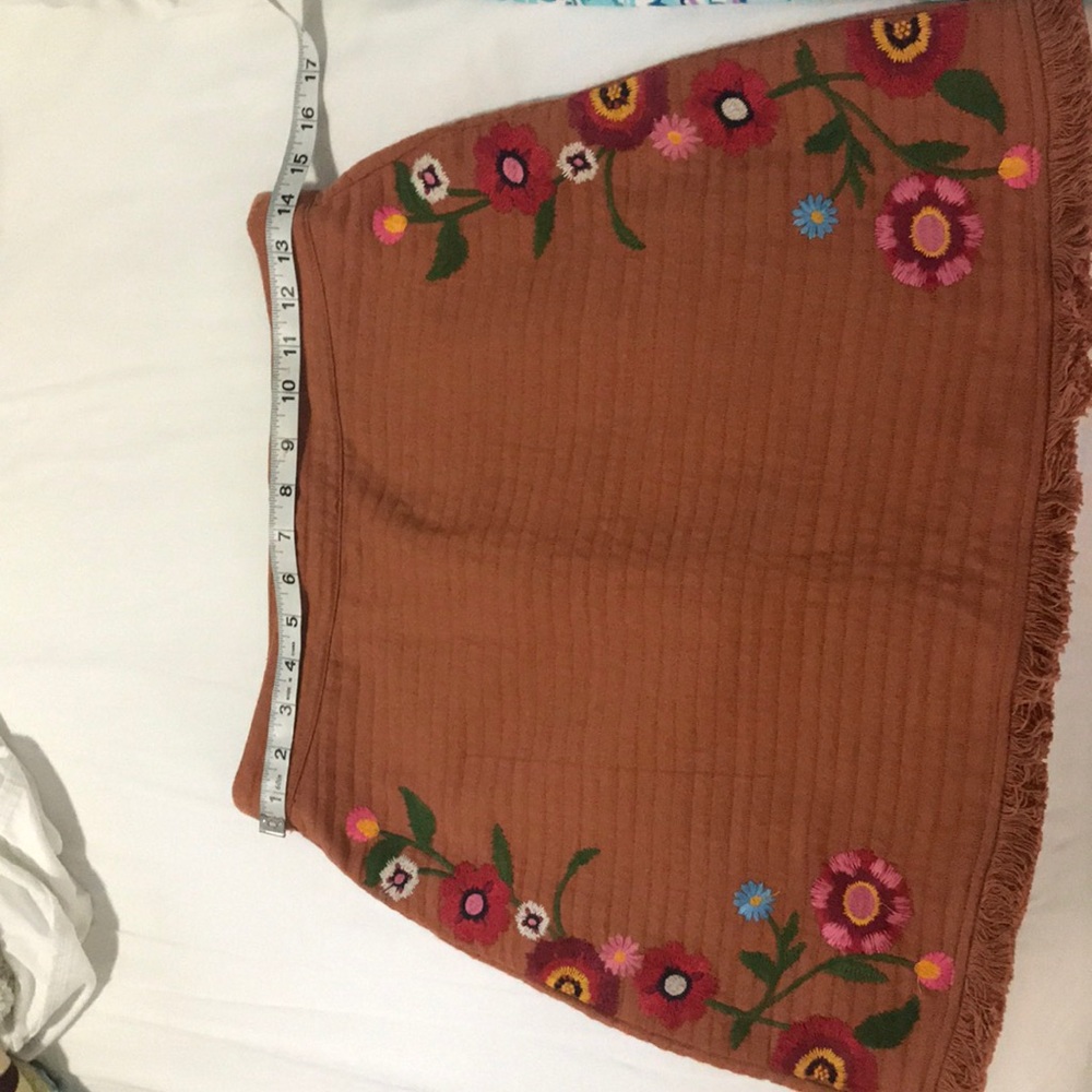 Super cute skirt, falls right above the knee.